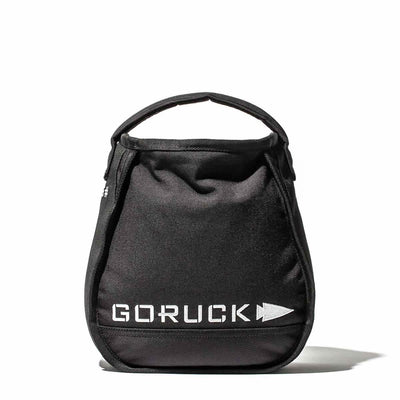 The black GORUCK Sand Kettlebells gym bag, featuring the brand's logo in white letters on the front, seamlessly integrates an enduring design. Set against a plain white background, it's perfect for transporting kettlebell essentials.