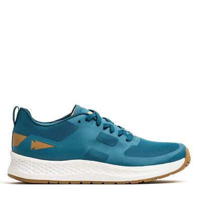 Introducing the Men's Rough Runner - Tidal Blue by GORUCK, a high-mileage athletic shoe featuring a vibrant blue design with a white textured sole and subtle brown accents. This shoe is equipped with a breathable mesh upper, lace-up closure, and enhanced comfort through Gradient Density EVA technology. A distinctive arrow design adorns the heel.